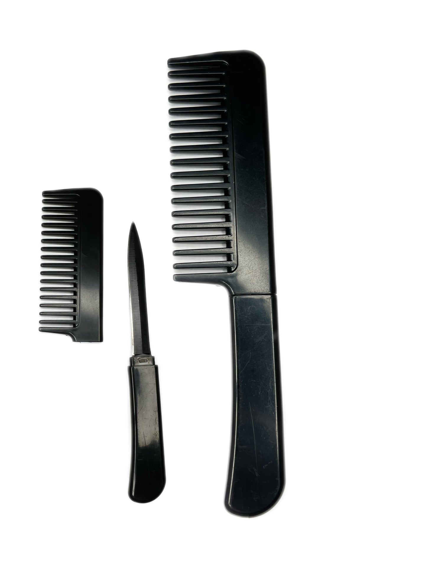Peigne à cheveux rose  avec couteau caché
